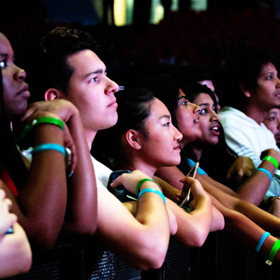 A row of seated students attending an event at the arena