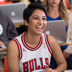 Image of a student sitting in a lecture hall